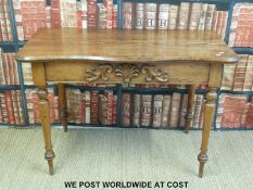 A pitch pine table with shaped top and turned legs (W114 x D62 x H76cm)