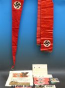 A quantity of Nazi German flags, armbands, pennants,