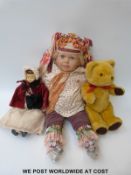 A vintage doll in Edwardian style costume 40cm tall, together with a c1980s blonde vinyl doll,