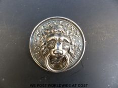 A probably silver Ceylon Rifle Corps badge,