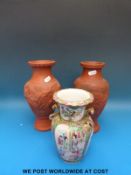 Two stoneware vases and a Chinese famille rose vase (largest 25cm tall)