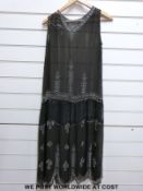 A 1920's chiffon cocktail dress with crystal beadwork and two embroidered shawls of similar age