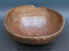 A 19thC carved African bowl with sieve ridges
