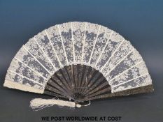 A 19thC Chinese fan made up of carved tortoiseshell,