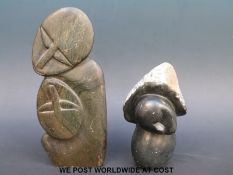 Two Inuit carved stone figures, one of a sleeping woman signed C.