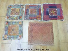 Four Labani Banjara chaklas with geometric design and cowrie shells to the edges,