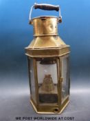 A large brass ship's head lamp stamped Patt & Sons,