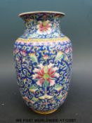 A Chinese famille rose vase on a blue ground with multi-coloured enamels iron red mark to base (19.