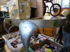 An oval metal framed bespoke c1960s table with glass top and coloured glass inserts to the sides