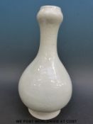 A Chinese celadon glaze bulbous vase with floral decoration,