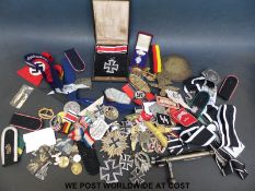 A quantity of mainly WWII German style militaria and badges