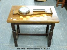 An oak barometer and a chess table (H58cm x L67cm x W41cm)