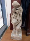 A carved marble statue of a Roman goddess and two cherubs