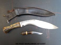 A horn handled kukri knife in leather sheath (31cm blade)