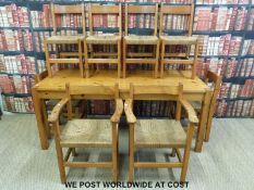 A pine table and eight chairs (H76 x L184 x W82cm)