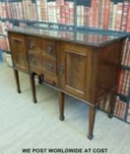 A 19th/20thC mahogany sideboard with two drawers flanked by cupboards (W136 x D44 x H94cm)