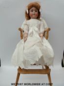 Simon Halbig bisque headed doll with open mouth, fixed blue eyes, red hair and articulated limbs,