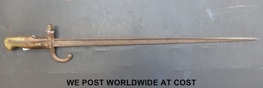 A c1877 French bayonet with the narrow 'T' form blade, with wood grips and brass pommel.