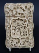 A 19thC Chinese carved ivory card case with exceptionally deep and intricate carving in a central