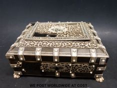 A horn and bone Anglo Indian Vizagapatam jewellery casket raised on paw feet (length 15.