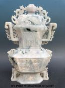 A Chinese mottled lavender and apple green jadeite vase and cover of flattened form,