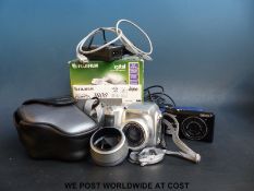 Two digital cameras, one Nikon Coolpix 55100, 12.