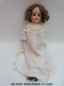 Armand Marseille bisque headed doll with open mouth, fixed blue eyes, brown hair,