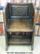 A late 19th/20thC carved oak monk's chair (W50cm)