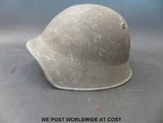 A European military helmet marked K IX to rear of rim