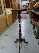 A mahogany torchere (height 93cm)
