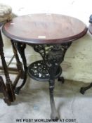 A cast iron and mahogany pub table (H70cm,
