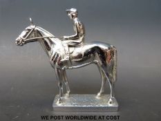 A chrome horse and jockey car mascot (length 10.