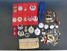 A collection of military badges to include 1st Highland Light Infantry Scottish Horse,