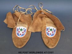 A pair of native American beaded moccasins