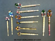 Ten 19thC carved bone bobbins including love tokens / marriage examples