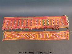 Two Banjara woven textile panels/belts (largest 75cm x 15cm)