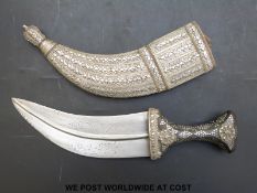A Middle Eastern jambiya dagger with an inlaid horn handle,