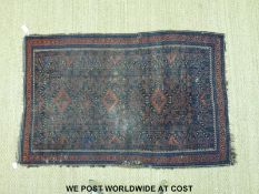 A wool rug with dark blue ground (177 x 118cm)