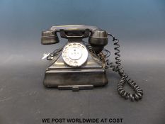 A vintage black bakelite telephone 1/232 CB with modern connections