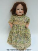 Reim Stener German bisque headed doll with open mouth, weighted blue eyes,