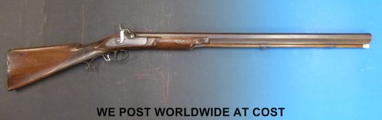 John Manton & Son 10 bore percussion hammer action rifle with 31in octagonal Damascus barrel