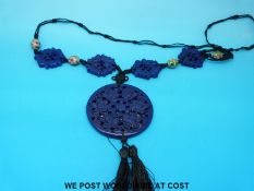 A carved lapis lazuli pendant with cloisonne beads