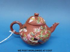 A miniature Yixing teapot with enamlled decoration birds and foliage