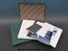 Three Concorde seat back pouches and contents including two leather examples,