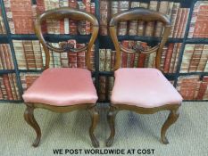 A pair of rosewood balloon back chairs