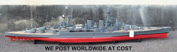 A kit built model of H.M.S Hood with three files of related magazines, 130cm long.