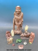 A large Chinese carved hardwood figure with bone teeth,