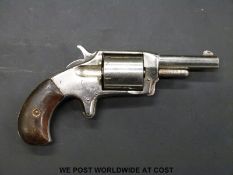 American .32 Deffender five shot revolver with 6cm barrel and wooden grips (overall length 17cm).