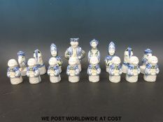 A ceramic Delft style chess set, height of king 15.5cm.