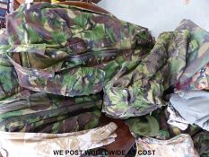 A collection of camouflage gear including old DPM jacket, includes three jackets,